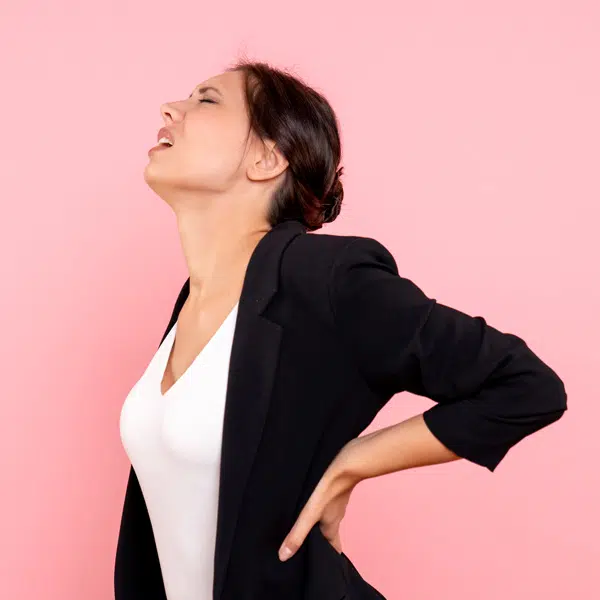 Woman experiencing back pain, indicating possible disc pain